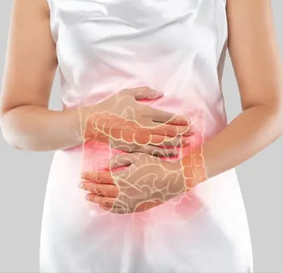 Person holding abdomen with highlighted intestines, representing Colectomy and digestive tract surgery.